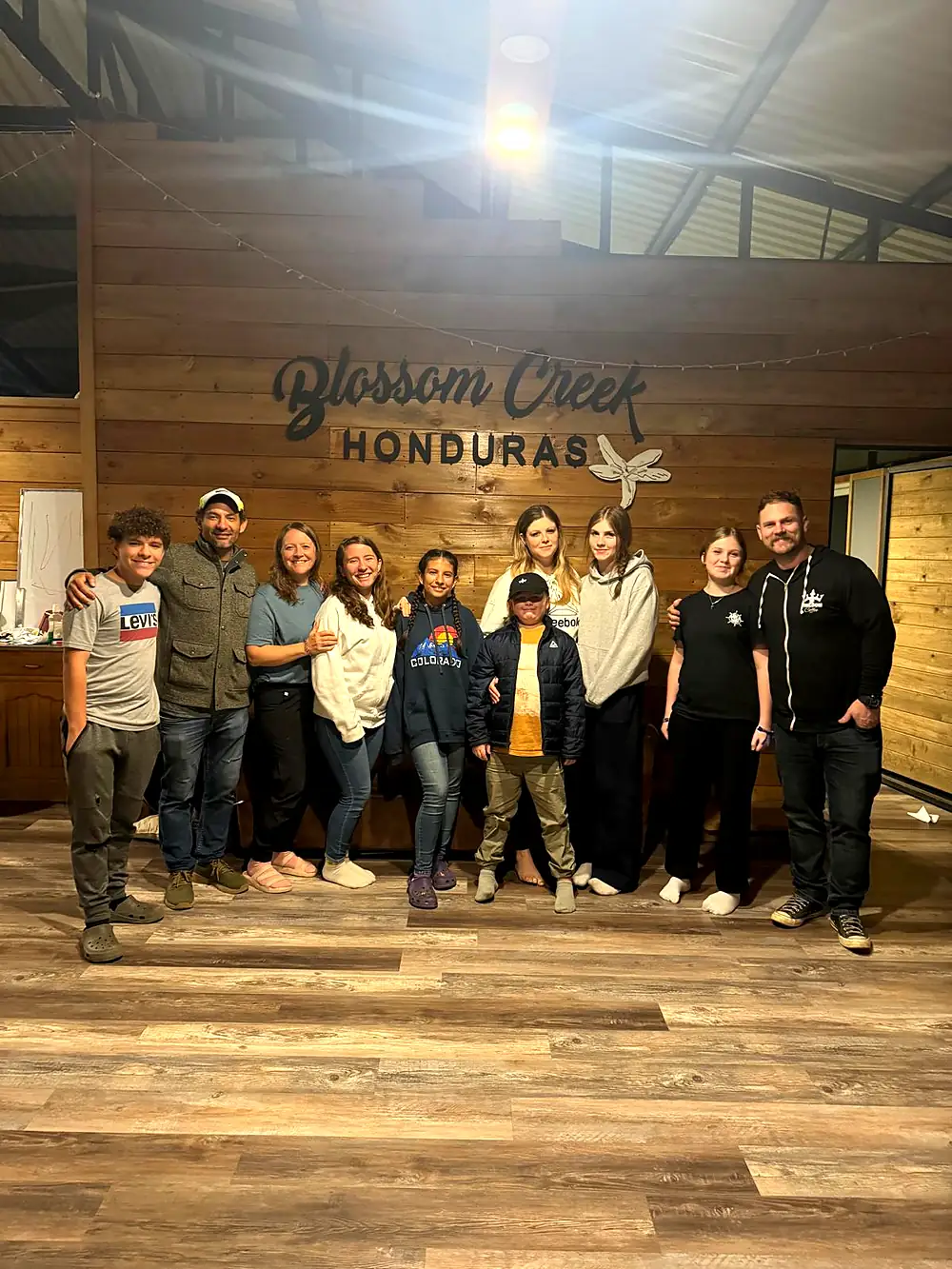 Our team gathered with farm staff inside the Blossom Creek Honduras mill